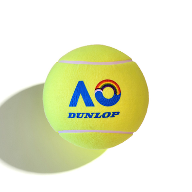 A yellow extra-large tennis ball with the AO (Australian Open) logo that has a rainbow detail in the O, and the brand name Dunlop printed on it in blue.