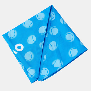 A bright blue square bandana, featuring a repeating pattern of white tennis balls and a white AO logo on the left side, displayed against a grey background.