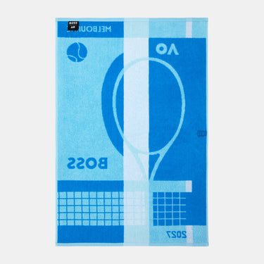 A rectangular beach towel featuring a blue and light blue tennis-themed graphic design with the text 'MELBOURNE 2027' and 'BOSS', displayed flat against a light gray background.