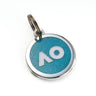 A round blue pet tag with the AO logo in white with silver edge, attached to a keyring, on a white background.