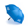 An open blue golf umbrella with 'AO' text printed on the canopy against a white background.